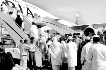 Pakistani hajis boarding a hajj flight
