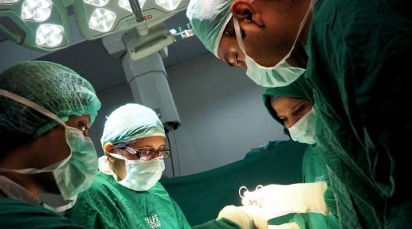 Surgeons performing Pakistan's first pediatric open-heart surgery at SIUT