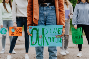 girls with climate change related posters